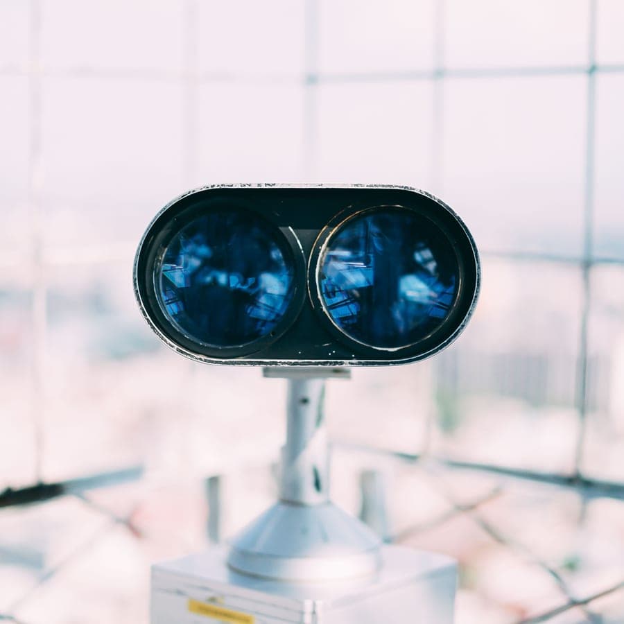 Illustrative stock photo: a close-up of a pair of binoculars